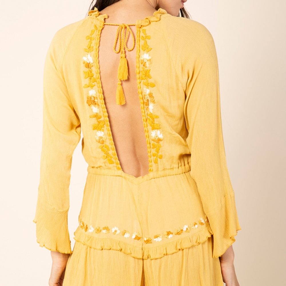 Long sleeved embroidered romper